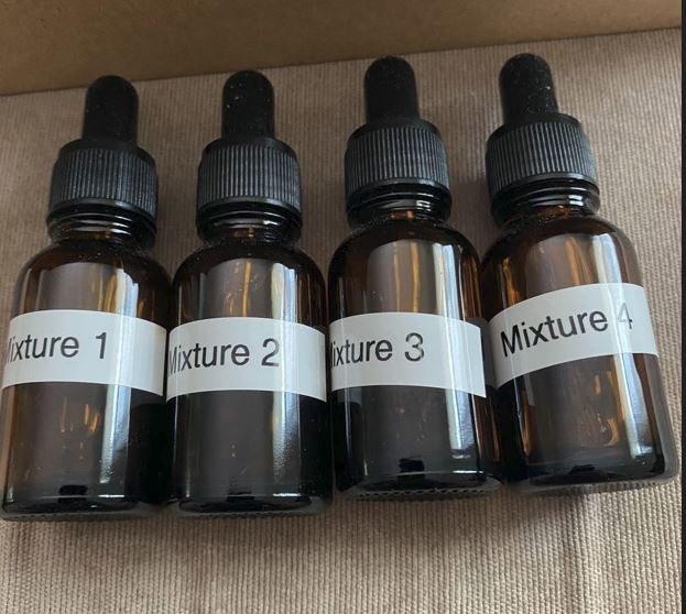Brown dropper bottles from early Grey Wolf beard-oil prototype work.